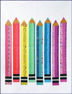 colorful pencils are lined up in a row on a white paper with blue border