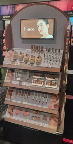 a display in a store filled with lots of cosmetics and makeup products on it's shelves