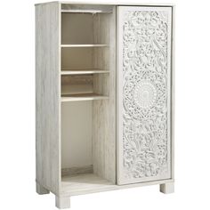 a white cabinet with carvings on the door and shelves in it's side view