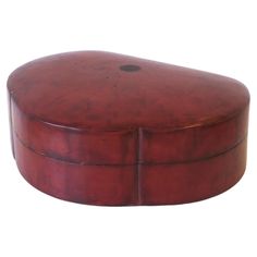 a round wooden box with no lid on it's sides, sitting against a white background