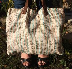 I brought this bag back from Nepal. It is made in a very beautiful material, it is hand-woven silk with beautiful blue and brown threads. It's so pretty! 2 small pockets are sewn inside and it also includes a small wallet made from the same fabric Dimensions: 48 cm x 38 cm Brown Bohemian Fabric Bags, Bohemian Brown Fabric Bags, Brown Travel Bag With Weaving Work, Brown Weaving Work Travel Bag, Brown Beach Bag With Weaving For Travel, Woven Fabric Bags For Everyday Use, Everyday Woven Fabric Shoulder Bag, Brown Tote Shoulder Bag With Weaving Work, Brown Weaving Work Tote Shoulder Bag