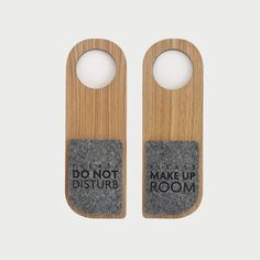 two wooden bottle openers that say don't disturb and make up room