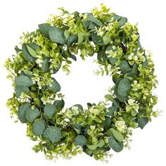 a wreath with green leaves and white flowers