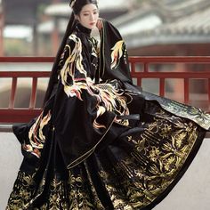 The Vividly Embroidered Phoenix Weaving Along The Sleeve Of Coat Grants Its Wearer Everlasting Peace And Blessings. Also, The Side Slits Bring Slimming Effect And Enhance The Sense Of Hierarchy. This Elegant Mingfu Coat Is Perfect To Pair With Hanfu Pleated Skirt Or Any Modern Bottoms. Stand-Up Collar Side Slit Fitted Waist Band Exquisite Phoenix Embroidery 6-Meter (19.7") Woven Gold Pleated Skirt Full Set Includes 1 Top And 1 Maxi Skirt Gold Pleated Skirt, Peace And Blessings, Traditional Asian Dress, Ancient Dress, Ancient Chinese Dress, Ancient Chinese Clothing, Fantasy Dresses, Elegante Casual, Chinese Clothing