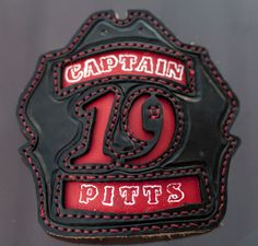 a patch with the name captain pitts written in red and black stitching on it