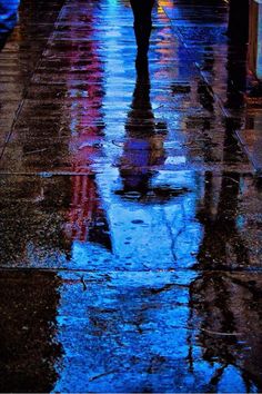 a person walking down the street with an umbrella