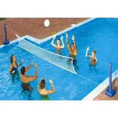 people are playing volleyball in the pool