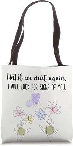 a white bag with flowers on it that says, what we met again i will look for