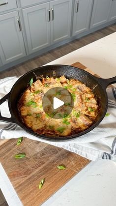 a skillet with some food in it on a table