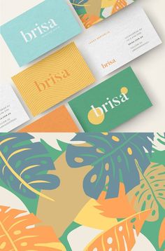 the business cards are designed with colorful tropical leaves and foliage, which is also used for branding