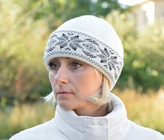 This listing is for hat only. This is a cuffed hat with fleece lining. The hat is very warm! It is suitable for low temperatures and skiing experiences. Suitable both for men and for women. Made out of natural lambswool in Estonia. Beautiful white hat with gray Fair Isle pattern. Fashionable and high-quality products are made out of lambswool in Nordic and Scandinavian styles. All items are high-quality and have unique designs. If you are looking for a high-quality Christmas present or just casu Warm Nordic Hats For Outdoor, Warm Nordic Beanie For Outdoor, Warm Nordic Beanie For Cold Weather, White Adjustable Fur Felt Hat, Nordic Knitted Winter Beanie, Beanie With Ears, Knitted Wool Beanie, Christmas Beanie, Woolen Scarves