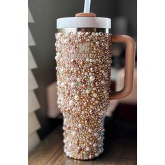 a coffee cup with some beads on it