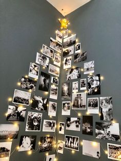 a christmas tree made out of photos with lights on the bottom and pictures hanging from it