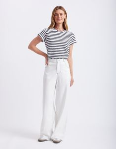 DESCRIPTION Elevate your wardrobe essentials with the Celeste Tencel Pants in White by 365 Days Clothing. These sleek pants are made from sustainable Tencel fabric, offering a luxuriously soft and breathable feel. Featuring a high-rise waist and a straight-leg fit, they provide a flattering silhouette while ensuring comfort. The classic five-pocket design is enhanced with contrasting stitching, adding a stylish touch to these versatile pants. Perfect for both casual and semi-formal occasions, th Tencel Pants, Sophisticated Office, Contrasting Stitching, Versatile Pants, Tencel Fabric, Weekend Outfit, 365 Days, Blue Blouse, Classic Shirt