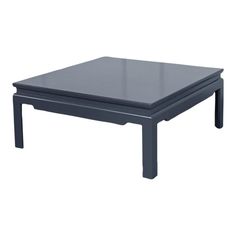 a black coffee table sitting on top of a white floor