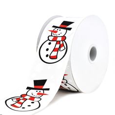 a white ribbon with a snowman design on the side and red, black, and white stripes