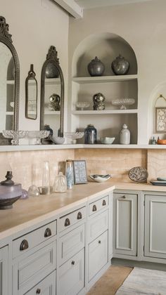 the kitchen is clean and ready to be used for cooking or baking, with many other things on the shelves