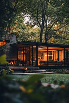 a modern house in the woods at night