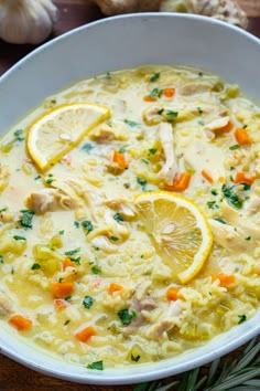 a white bowl filled with chicken and lemon soup