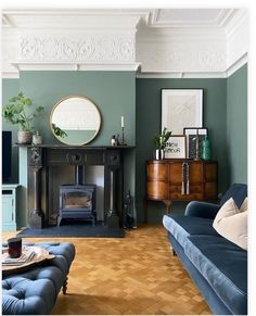 a living room filled with furniture and a fire place next to a wooden floored floor