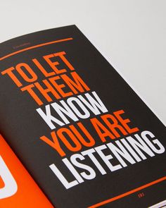 an orange and black book with the words to let them know you are listening on it