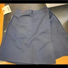 School Uniform Navy Blue Skort Blue Bottoms With Pockets For School, Spring School Uniform Cotton Bottoms, Fitted School Bottoms With Pockets, Fitted Solid Color Shorts For School, Navy Cotton Bottoms For School, Cotton Short Length Skort For School, Blue Denim Skirt For School, School Uniform Style Short Skort, Spring School Uniform Bottoms With Pockets