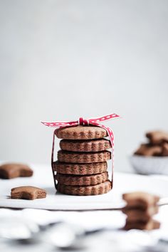 a stack of cookies sitting on top of a white table