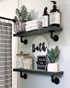 a bathroom with two shelves holding various items