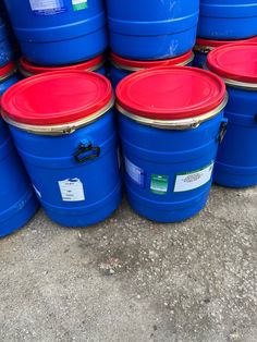 several blue and red barrels stacked on top of each other