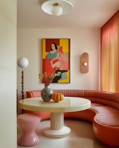 a living room with orange and pink furniture