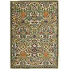 a green rug with an ornate design on the front and back side, in various colors