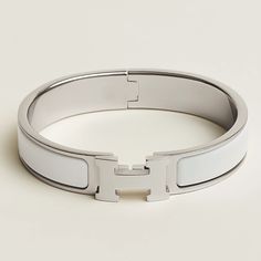 Narrow Bracelet In Enamel. This Bracelet Opens And Closes Thanks To An Ingenious Toggle Clasp Which Reveals An "H". Made In France Metallic Finish: Palladium Plated Circumference: 6.7" | Width: 0.47" Color: Blanc/Silver Item Is Used. Scratches On Hardware. Good Condition. Hermes Bracelet Silver, Hermes Bracelet White, H Bracelet, Hermes Bracelet, Hermes Jewelry, Xmas Ideas, Toggle Clasp, White Silver, Silver Bracelets