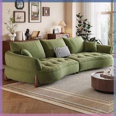 a green couch sitting on top of a rug in a living room