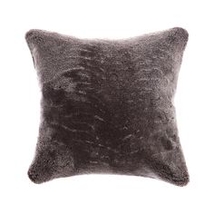 a dark gray pillow that is on a white background with no one in the photo