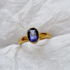 Iolite gold ring, 14K yellow gold Iolite ring, natural oval cut Iolite gemstone jewelry, romantic gift ring, gold ring, wedding gift ring ------------------------------- Size/Dimension (Approx) : All Sizes Available Gemstone : Iolite Stone Shape : Oval Cut Stone Size (Approx) : 9x6 mm Stone Color : Blue ------------------------------- The 14K yellow solid gold bezel and solid yellow gold ring are both shined to an extremely high polish. All rings are packaged and shipped in a beautiful ring box. The main stone is natural, oval cut, iolite. The pictures have been enlarged to show the details. The price is for a 14k gold ring, if you want to order the ring in 18k or 22k gold please convo me prior to purchase. IMPORTANT NOTES This gold jewelry is custom made order jewelry so its possible to s Iolite Ring, Gold Ring Wedding, Iolite Stone, Lovely Ring, Gift Ring, 14k Gold Ring, Romantic Gift, Beautiful Ring, Ring Wedding