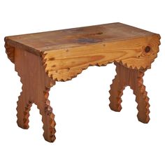 a wooden bench made out of wood with an intricate design on the top and bottom