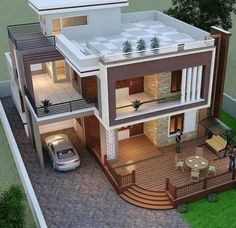 an aerial view of a two story house with a car parked in the front yard