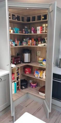 an open pantry in the middle of a kitchen