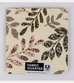 the fabric is printed with leaves and dots on white background, as well as black and brown