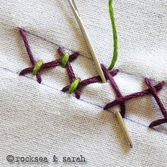 two crocheted stitches are next to each other on a white piece of cloth