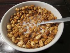 a bowl filled with cereal sitting on top of a table