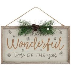 a wooden sign that says wonderful time of the year with pine cones and snowflakes