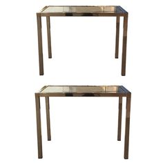 two mirrored tables sitting side by side with the same design on each table top and bottom