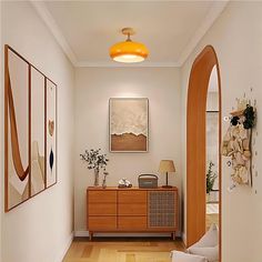 a hallway with an arched doorway and wooden furniture in the center, along with pictures on the wall