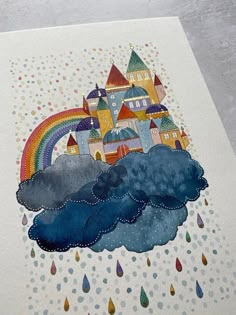 a card with an image of a castle and rainbow in the sky on top of it