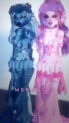 two dolls are standing next to each other in front of a wall with the words mermaids on it