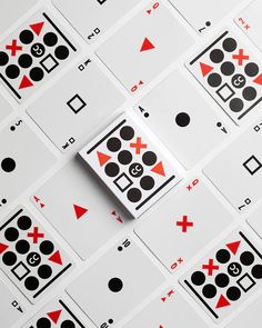 playing cards with black and red numbers on them are arranged in rows to form an x