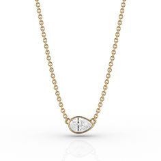 The RAE fancy-cut pendant is inspired by the sleek elegance of modern design; minimal yet striking, the East-West recycled yellow gold bezel setting perfectly frames our Skydiamond. Sitting either high on your collarbone at its shortest length, or adjusted to sit lower as desired - our modern solitaire necklace is a contemporary classic which can be worn every day. Designed to be buildable; layer and pair effortlessly with other RAE collection pieces. Gold Pear-shaped Diamond Solitaire Necklace, Pear-shaped Yellow Gold Solitaire Necklace, Yellow Gold Pear-shaped Necklace With Single Cut Diamonds, Refined Diamond Cut Pendant Necklace, Pear-shaped Bezel Setting Fine Jewelry Necklace, Pear Pendant, East West, Contemporary Classic, Solitaire Necklaces