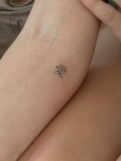 a person with a tattoo on their arm