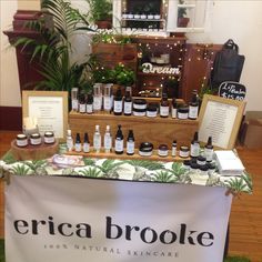 the display table is full of products for sale in front of a sign that says, erica brooke